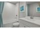 Bathroom with a bathtub, toilet, and white vanity at 31556 Woodland Race Loop, Wesley Chapel, FL 33545