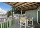 Outdoor dining area on deck with waterfront views at 2505 Bay Blvd # 1, Indian Rocks Beach, FL 33785