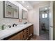 Bathroom with double vanity, updated fixtures, and shower at 2505 Bay Blvd # 1, Indian Rocks Beach, FL 33785