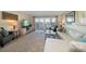Living room with sectional sofa and access to balcony at 2505 Bay Blvd # 1, Indian Rocks Beach, FL 33785