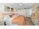 Bright bedroom with king-size bed and barn doors at 2505 Bay Blvd # 1, Indian Rocks Beach, FL 33785
