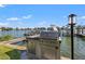 Outdoor kitchen with grill and water views at 2505 Bay Blvd # 1, Indian Rocks Beach, FL 33785