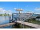 Private boat dock with lift for easy boat access at 2505 Bay Blvd # 1, Indian Rocks Beach, FL 33785