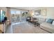 Bright living room with sectional sofa and water views at 2505 Bay Blvd # 1, Indian Rocks Beach, FL 33785
