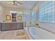 Bathroom with a soaking tub and walk-in shower at 4923 Willow Ridge Ter, Valrico, FL 33596