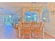 Charming dining area with wooden table and chairs, and access to backyard at 4923 Willow Ridge Ter, Valrico, FL 33596