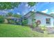 Landscaped backyard with lush greenery at 4923 Willow Ridge Ter, Valrico, FL 33596