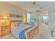 Main bedroom with wood bed frame and ensuite bathroom access at 4923 Willow Ridge Ter, Valrico, FL 33596