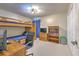 Bedroom with bunk beds, desk, and ample closet space at 4923 Willow Ridge Ter, Valrico, FL 33596