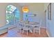 Charming dining room featuring a wood table and chairs, and an arched window at 4923 Willow Ridge Ter, Valrico, FL 33596