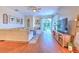 Living area with hardwood floors, sectional sofa and sliding doors to patio at 4923 Willow Ridge Ter, Valrico, FL 33596