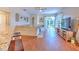 Bright living room with hardwood floors, large TV, and comfy seating at 4923 Willow Ridge Ter, Valrico, FL 33596