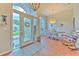 Bright and spacious entryway with wood floors, an arched window, and a charming front door at 4923 Willow Ridge Ter, Valrico, FL 33596
