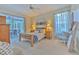 Main bedroom with sliding doors to patio and calming decor at 4923 Willow Ridge Ter, Valrico, FL 33596