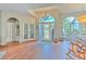 Spacious entryway with wood floors, an arched window, and French doors at 4923 Willow Ridge Ter, Valrico, FL 33596