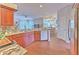 Kitchen with granite countertops, stainless steel appliances, and wood cabinets at 4923 Willow Ridge Ter, Valrico, FL 33596