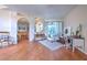 Bright and airy living room with hardwood floors, comfortable seating, and access to other rooms at 4923 Willow Ridge Ter, Valrico, FL 33596