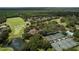Aerial view of community with golf course, tennis courts, and clubhouse at 4923 Willow Ridge Ter, Valrico, FL 33596