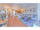 Relaxing living room with hardwood floors, sectional sofa, and access to patio at 4923 Willow Ridge Ter, Valrico, FL 33596