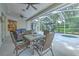 Screened patio with seating area and a spa at 4923 Willow Ridge Ter, Valrico, FL 33596