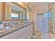 Bathroom with granite vanity and large mirror at 4923 Willow Ridge Ter, Valrico, FL 33596