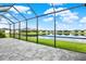 Serene screened patio with lake view, perfect for relaxing at 14424 59Th E Cir, Bradenton, FL 34211