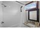 Clean bathroom with a shower/tub combo and granite vanity at 402 E Emma St, Tampa, FL 33603