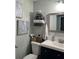 Clean bathroom with a vanity, mirror, and stacked towels at 525 San Jose Dr, Dunedin, FL 34698