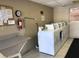 Shared laundry room with multiple washing machines and dryers at 2525 W Bay Dr # B32, Largo, FL 33770
