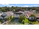 Aerial view of home with lush greenery, well-maintained landscaping, and charming neighborhood at 3147 Calvano Dr, Land O Lakes, FL 34639