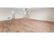 Spacious living room with ample natural light and stylish wood flooring throughout at 3147 Calvano Dr, Land O Lakes, FL 34639