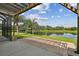 Lake view patio with pergola and brick at 4411 Hawksley Pl, Wesley Chapel, FL 33545