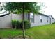 Rear exterior view of house with fenced yard at 14117 Weddington Ter, Hudson, FL 34669