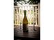 Patio furniture with wine and glasses overlooking lake at 14117 Weddington Ter, Hudson, FL 34669