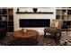 Living room with fireplace, chair, and coffee table at 14117 Weddington Ter, Hudson, FL 34669