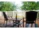 Relaxing patio with seating area and lake view at 14117 Weddington Ter, Hudson, FL 34669