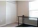 Bedroom with desk, closet, and window at 14117 Weddington Ter, Hudson, FL 34669