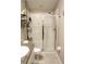 Bathroom with shower, toilet and storage shelving at 14117 Weddington Ter, Hudson, FL 34669
