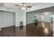 Open concept living area with dark hardwood floors and access to other rooms at 2295 Americus E Blvd # 27, Clearwater, FL 33763