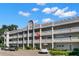Two-story building with multiple units and ample parking at 2295 Americus E Blvd # 27, Clearwater, FL 33763