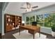 Home office with built-in wooden shelving and large window views at 2295 Americus E Blvd # 27, Clearwater, FL 33763