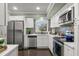 Updated kitchen with stainless steel appliances and a mosaic backsplash at 2295 Americus E Blvd # 27, Clearwater, FL 33763