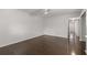 Another bedroom with dark hardwood floors and access to hallway at 2295 Americus E Blvd # 27, Clearwater, FL 33763