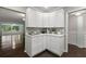 Updated kitchen features white shaker cabinets, quartz countertops, and ample storage at 2295 Americus E Blvd # 27, Clearwater, FL 33763