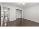 Spacious bedroom with hardwood floors and mirrored closet at 2295 Americus E Blvd # 27, Clearwater, FL 33763