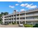 Two-story building with multiple units and ample parking at 2295 Americus E Blvd # 27, Clearwater, FL 33763