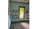 Bedroom with graffiti and damaged walls and floor at 4206 Durant Rd, Valrico, FL 33596