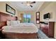 King-size bed, large window, and private balcony at 12000 Gulf Blvd # 206N, Treasure Island, FL 33706