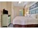 Bedroom with a queen-size bed, dresser, and window at 12000 Gulf Blvd # 206N, Treasure Island, FL 33706