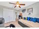 Bedroom with daybed, decorative pillows, and ceiling fan at 18773 Deer Tracks Loop, Lutz, FL 33558